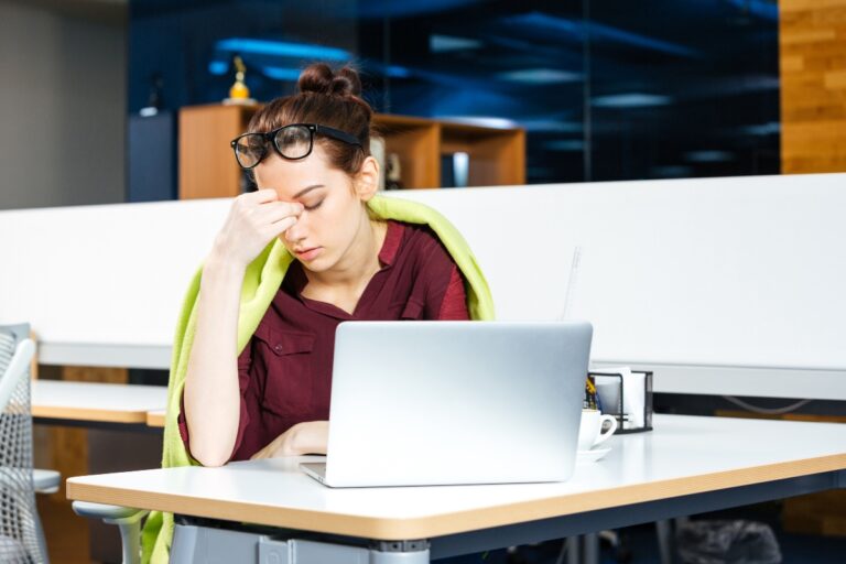 Young woman wondering why her work is making her depressed