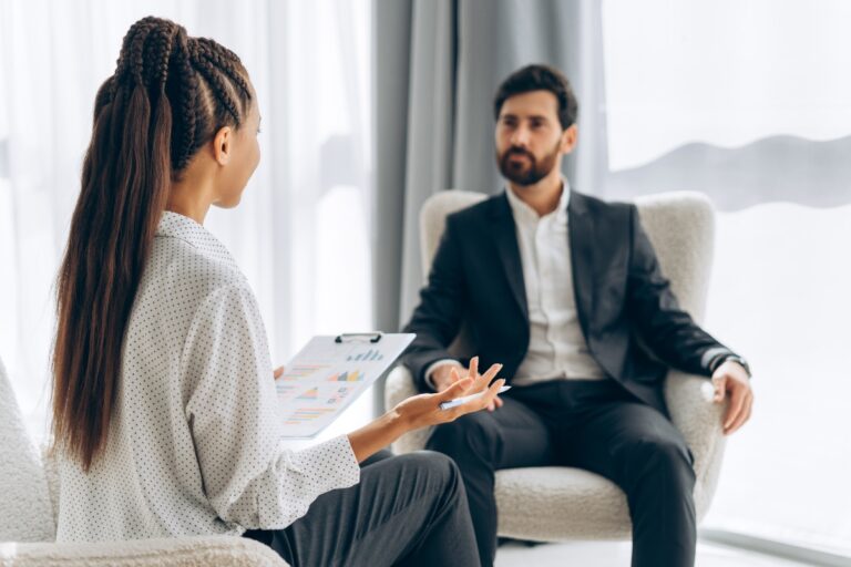 Psychiatrist talking to her patient and treating their depression