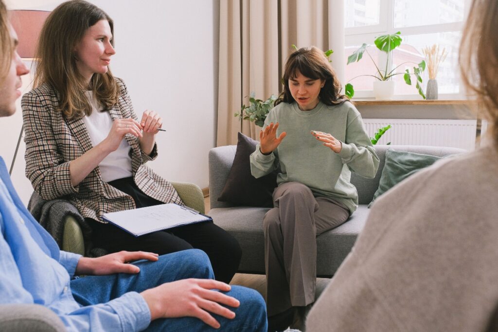Person meeting with a therapist to discuss mental health concerns and find the right therapy support.