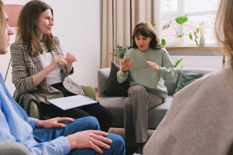 Person meeting with a therapist to discuss mental health concerns and find the right therapy support.